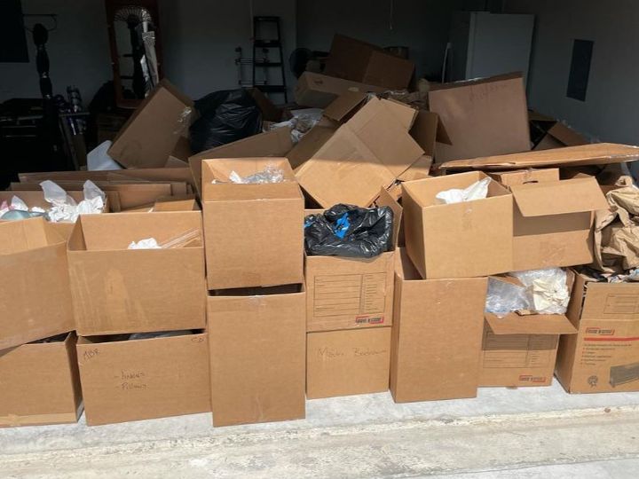 Estate cleanout with labeled moving boxes
