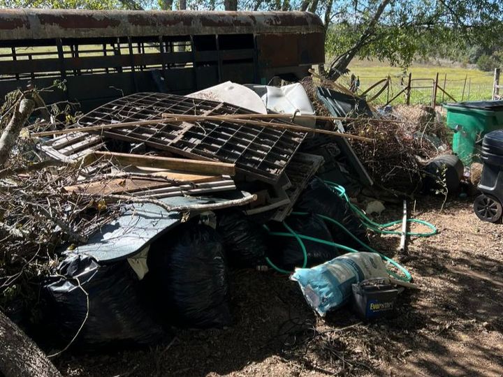 Yard debris — branches, brush and bagged waste — hauled off